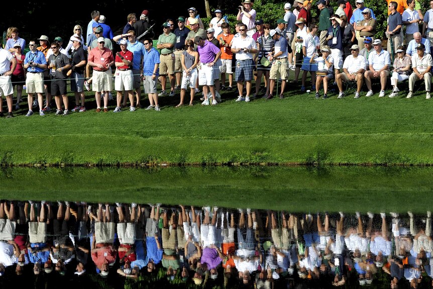 Fans on the 16th hole watch a practice round at Augusta.