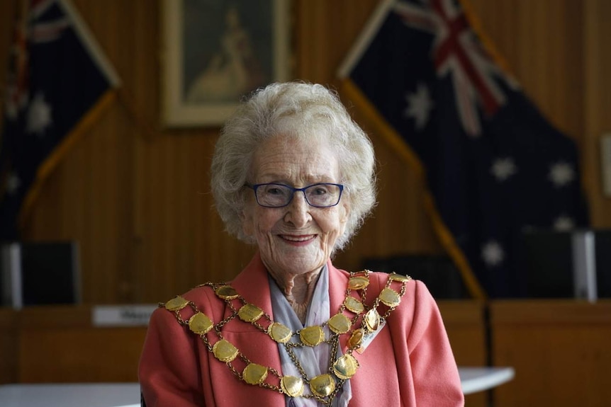 Cobar mayor Lilliane Brady in the council chambers wearing her gold mayoral chain.