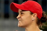 Ash Barty clenches her fist and grins