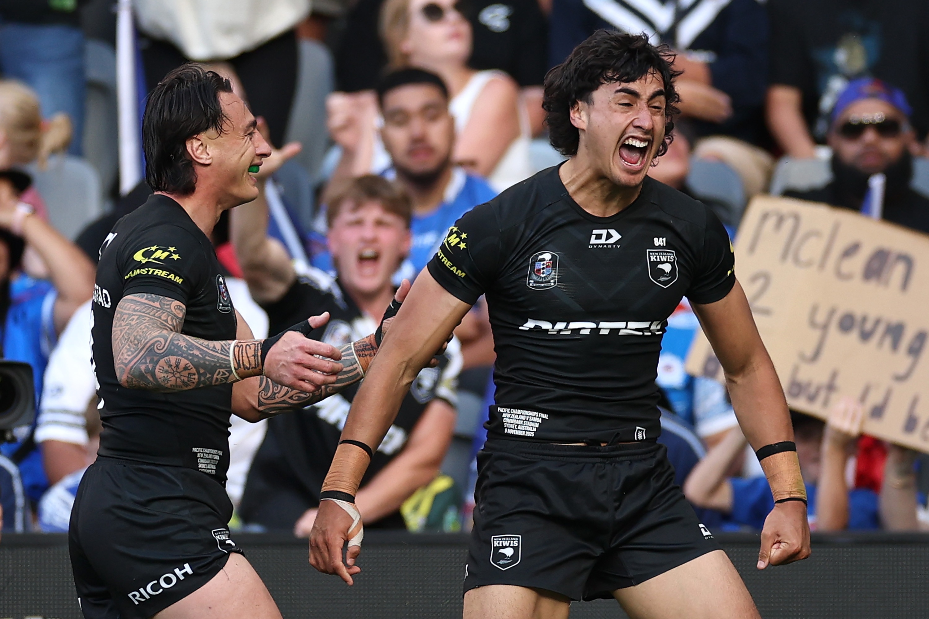 A jubilant McLean celebrates scoring a try