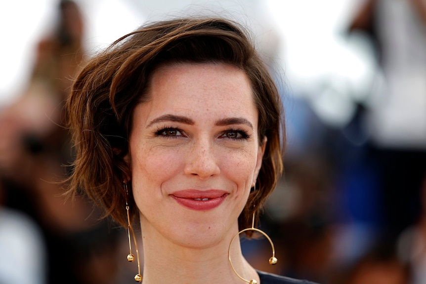 A close-up of smiling actor Rebecca Hall.