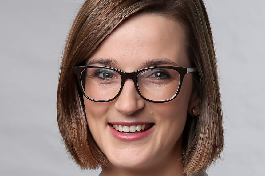 Professional headshot of a smiling woman