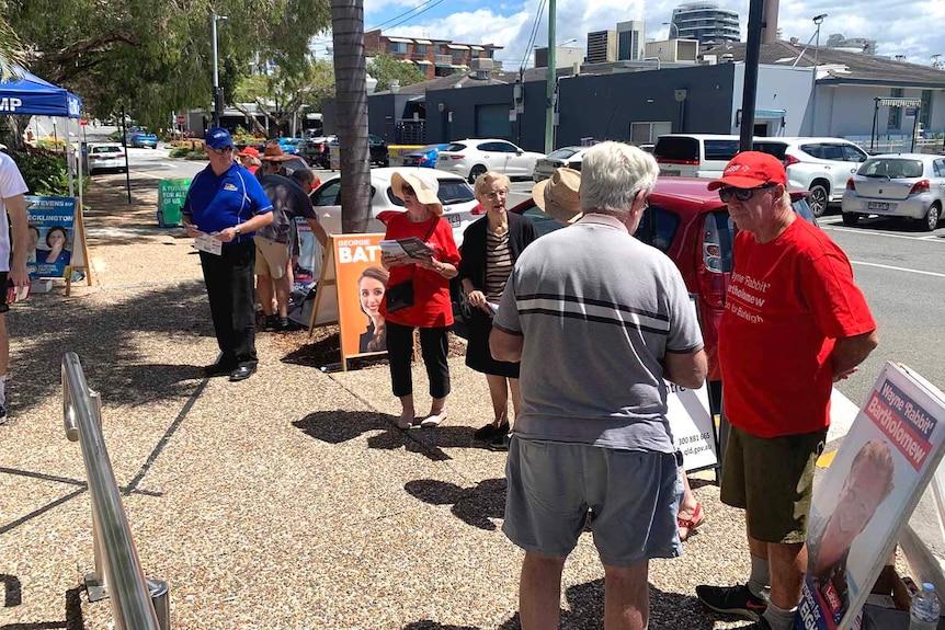 Candidates outside an early voting centre on the Gold Coast