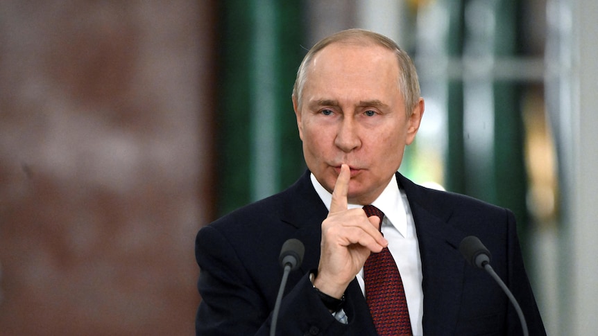 Russian President Vladimir Putin speaks during a news conference.