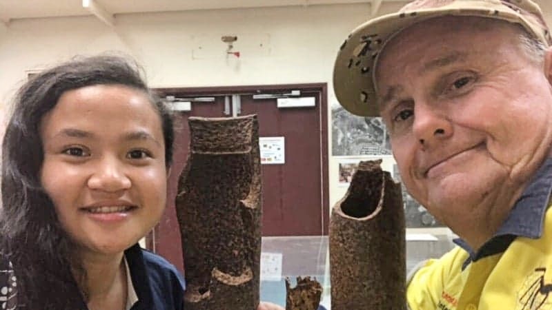 Chelsea Suter (left) daughter of Dave Suter (right) standing with bomb relics.