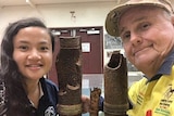 Chelsea Suter (left) daughter of Dave Suter (right) standing with bomb relics.