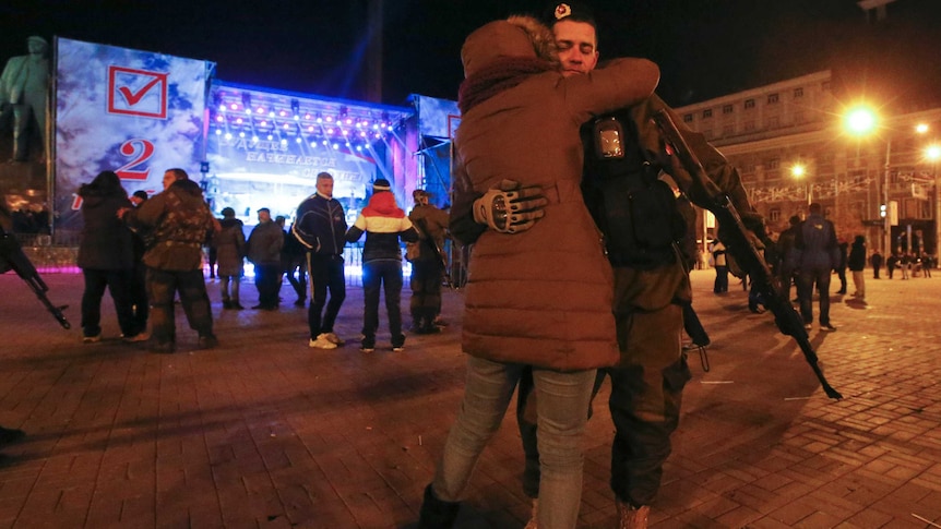 Pro-Russian separatist celebrates after vote in eastern Ukraine