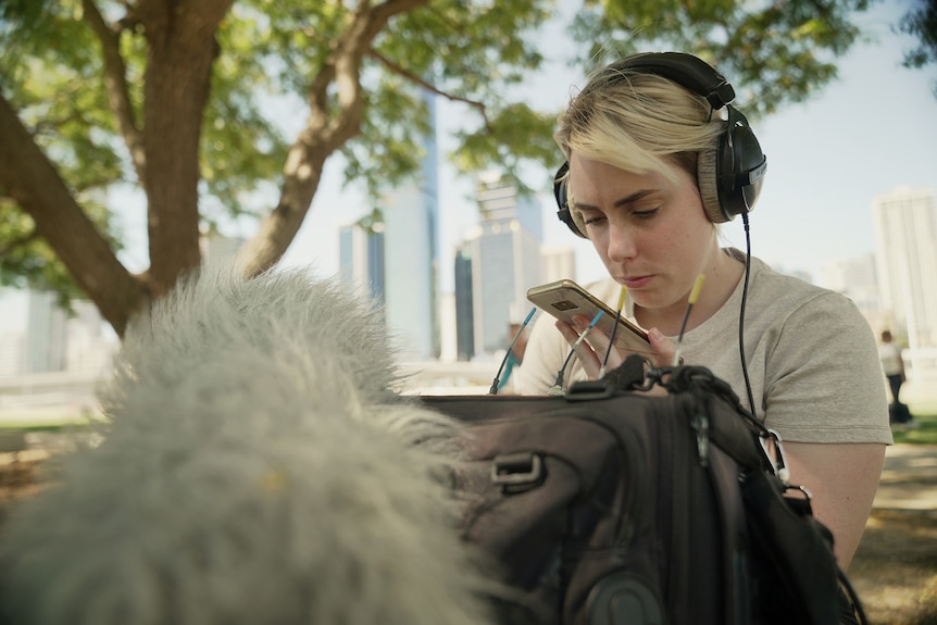 Lily uses a mobile phone to help with her sound gear