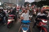 Supporters of Indonesian President Joko Widodo celebrate during a rally in Jakarta, Indonesia, Wednesday, April 17, 2019.