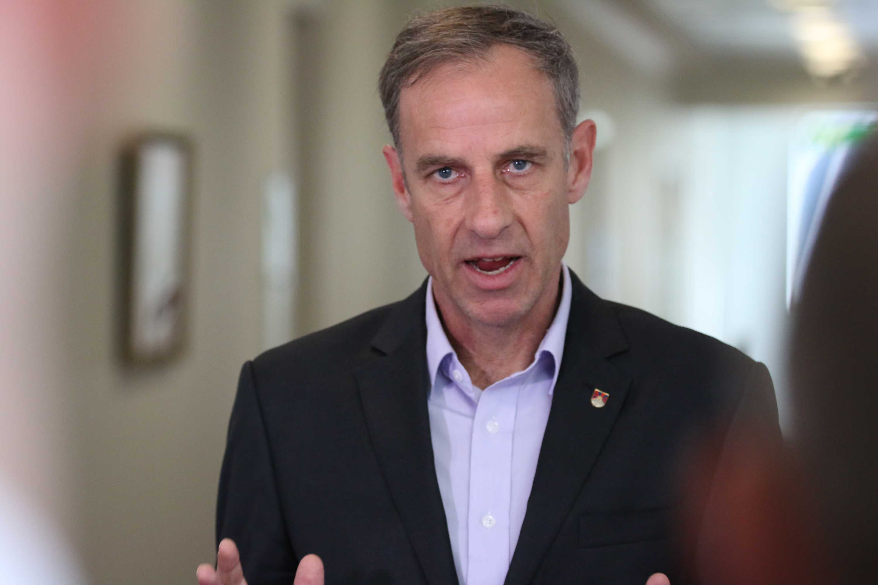 Senator McKim is mid sentence while standing in the Parliamentary Press Gallery.