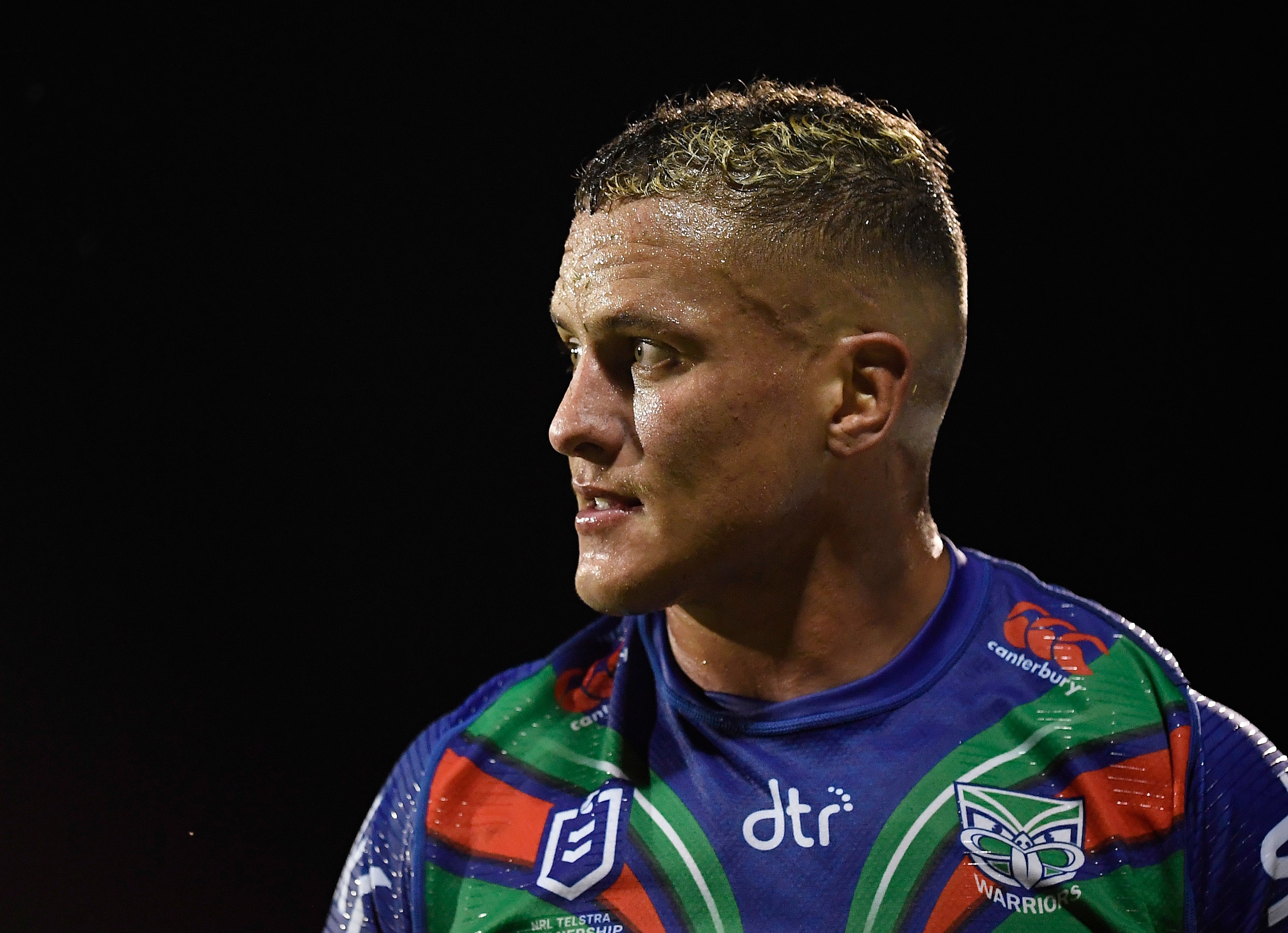 A man looks on during a rugby league match 