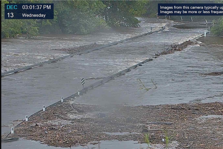Rapidly rising floodwater at Peets Bridge, south of Cairns