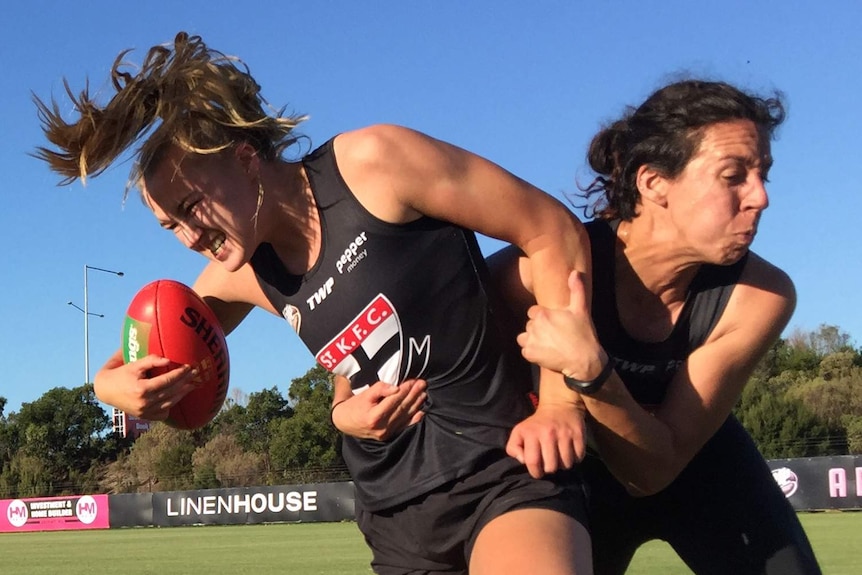 Southern Saints player Alison Brown tackled by teammate Jamilla Hull at training.