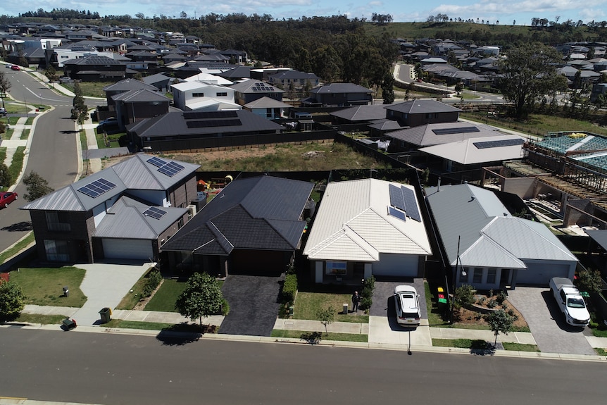 White roof among black and grey roofs