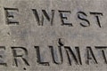 Stone inscription over the door on the central clock tower