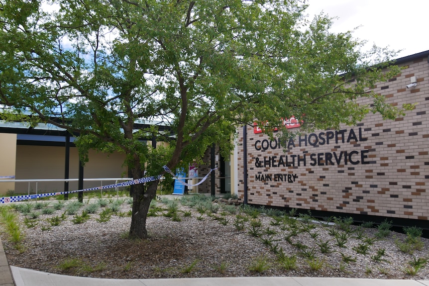 the outside of cooma hospital with a tree