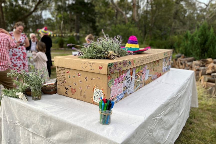 a cardboard coffin outside