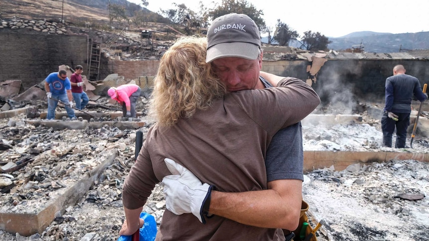 LA residents in a burnt-out home