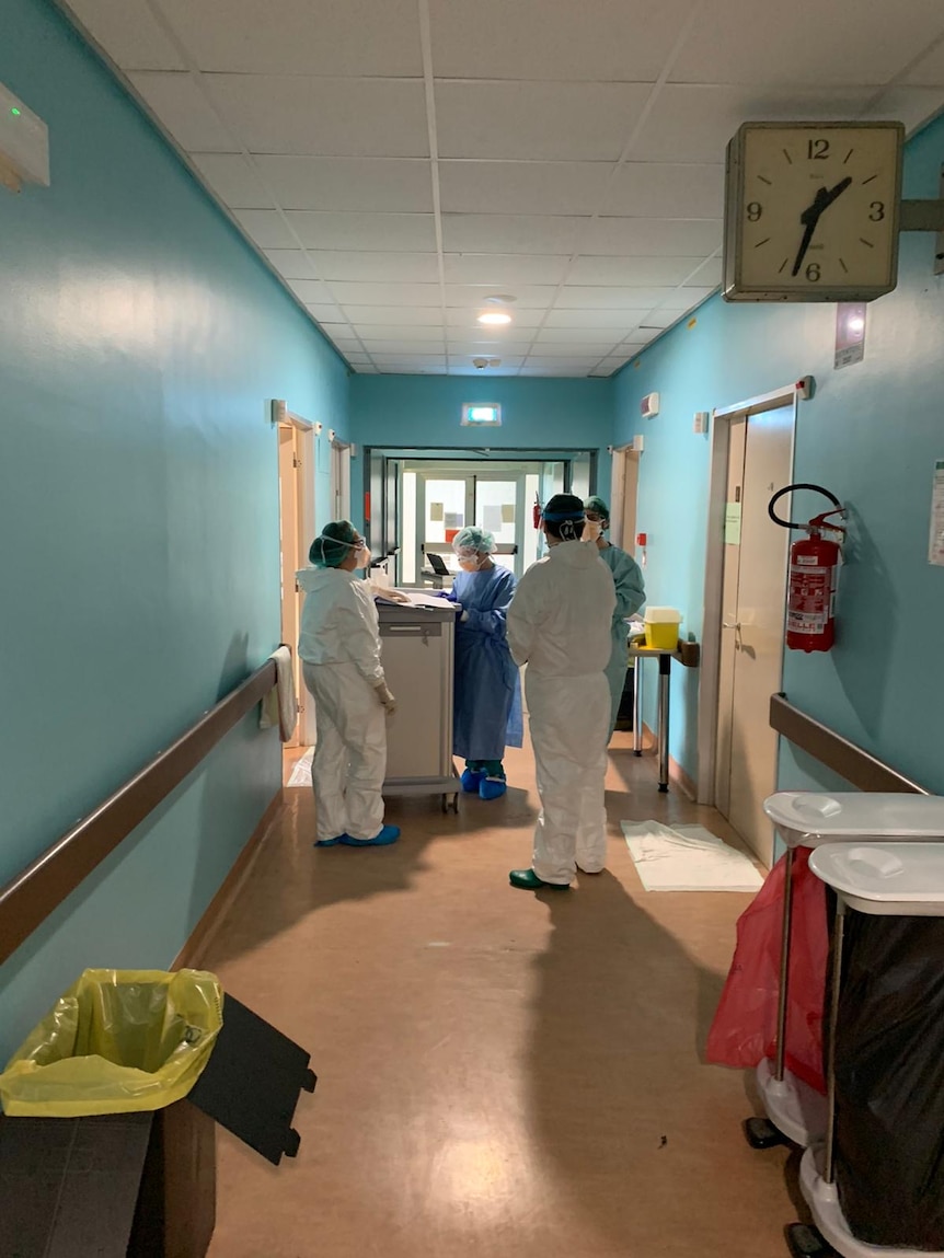 Doctors in the hallway of Cremona hospital.