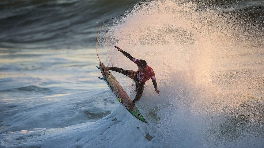 Filipe Toledo rides a wave in Portugal