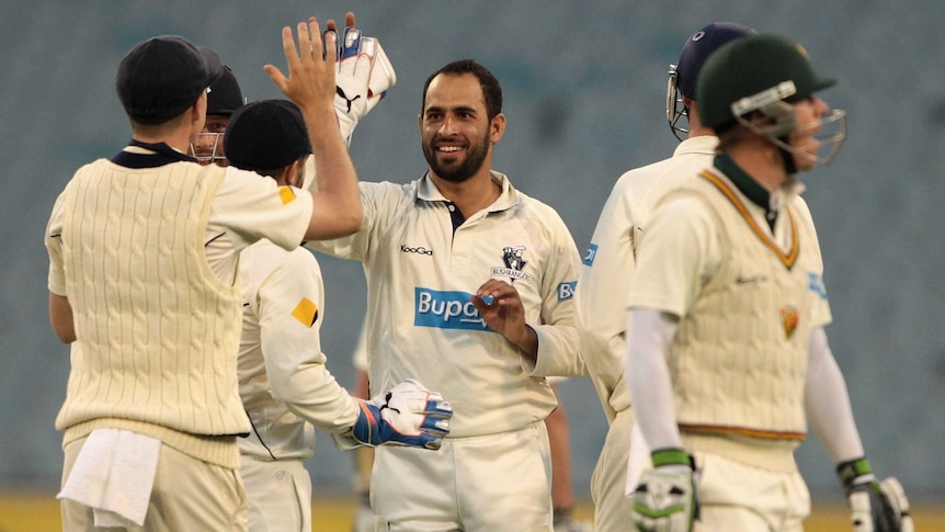 The Bushrangers' Fawad Ahmed takes the wicket of Tasmania's Xavier Doherty in the day-night Shield match