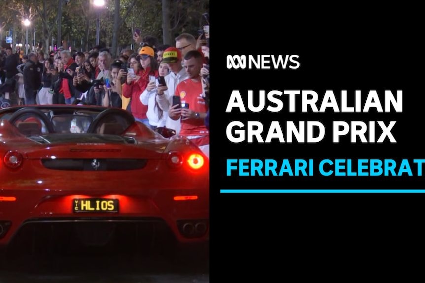 Australian Grand Prix, Ferrari Celebrated: A red sports car drives down a street lined with people.
