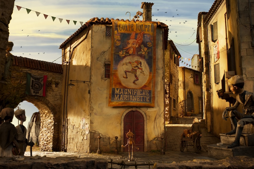 An animated scene showing an old cobble-stone Italian piazza with a large banner reading "Magnifiche Marionette".