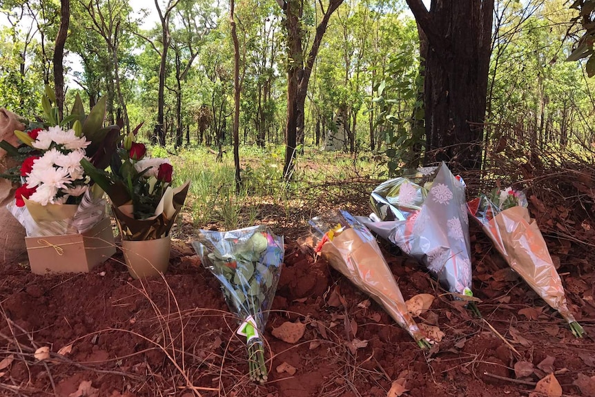 Flowers on the side of the road at crash scene