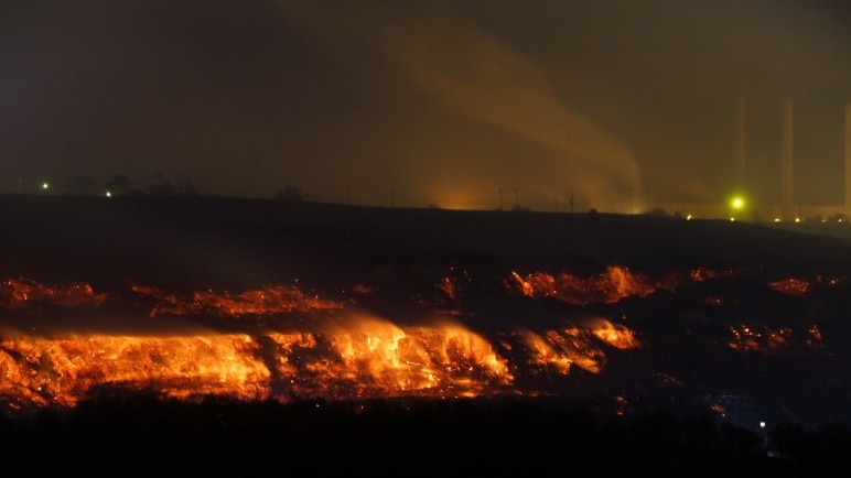 Wider night shot of coal face burning at Hazelwood mine fire February 25, 2014.