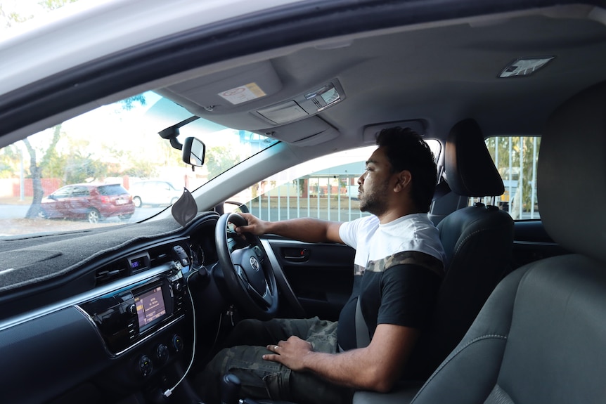 a man driving a car