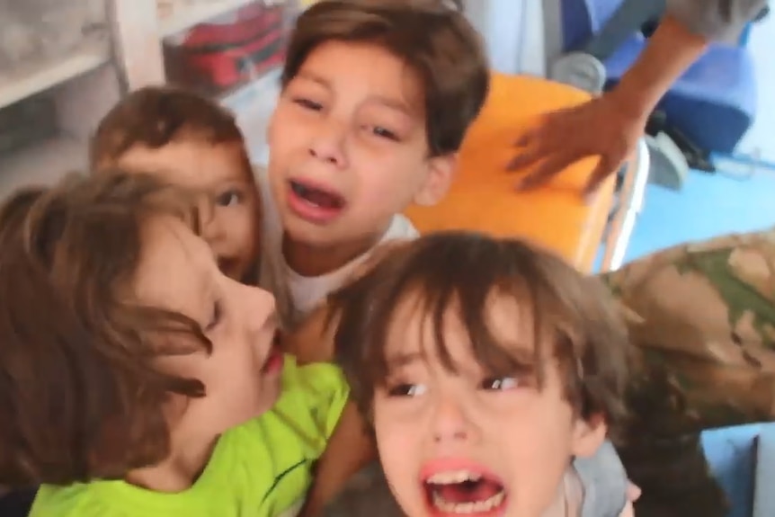 Dramatic footage shared by the Syrian Civil Defense shows distressed children panicking during a rescue operation.