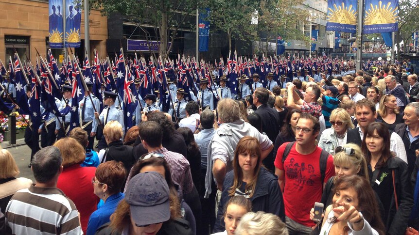 Crowds alongside service personnel at Sydney's Anzac day march