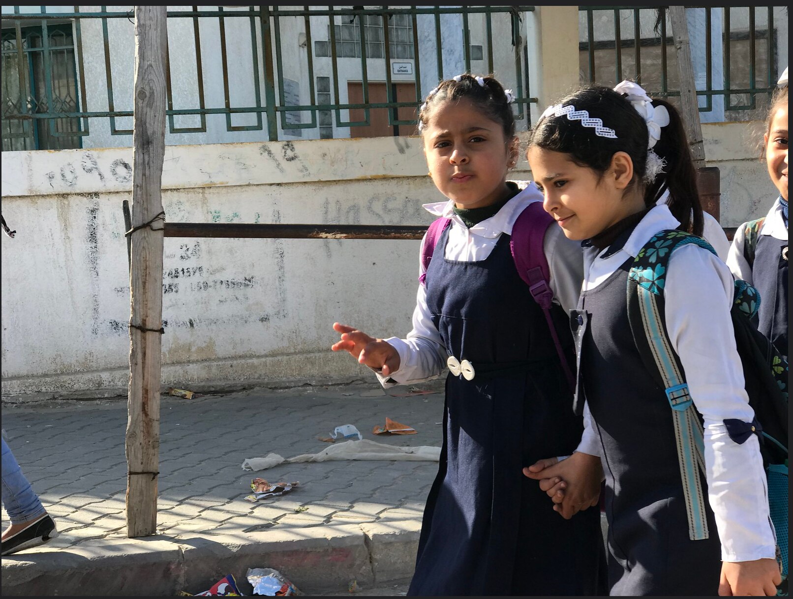 School girls walk down the street in gaza before the war 