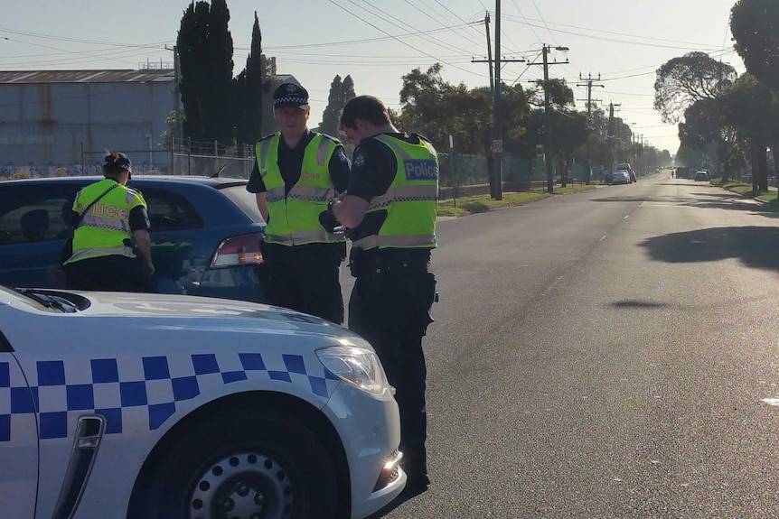 Police at the scene of a stand-off in Altona North