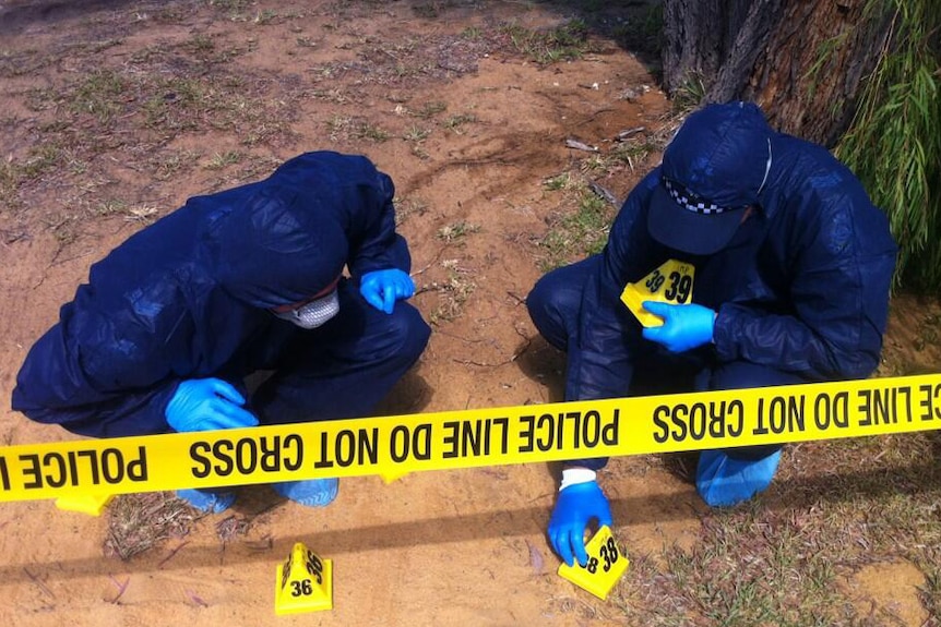 Police place markers at crime scene