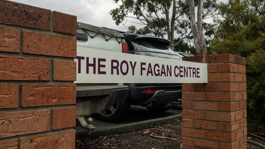 A sign saying "Roy Fagan Centre" outside a carpark