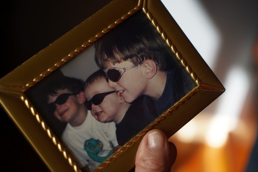 three young boys in a photograph