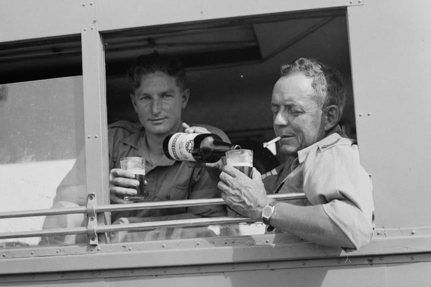 Soldiers enjoying a refreshing beverage at the Beersheba racing meet in May, 1940.