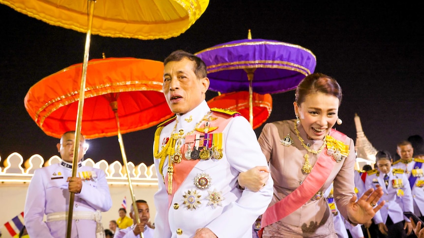 The Thai King and Queen surrounded by colourful umbrellas