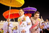 The Thai King and Queen surrounded by colourful umbrellas