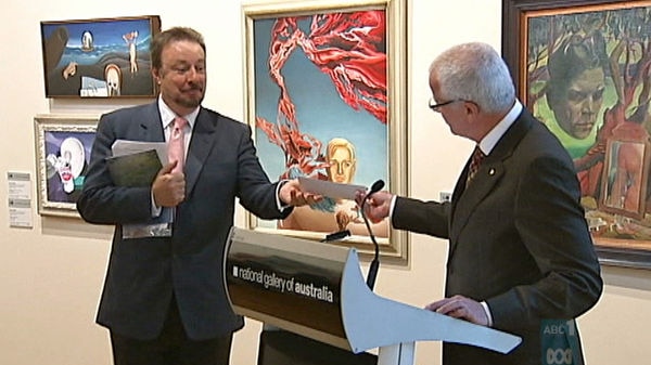 National Gallery of Australia director Ron Radford receives a cheque for $2 million.