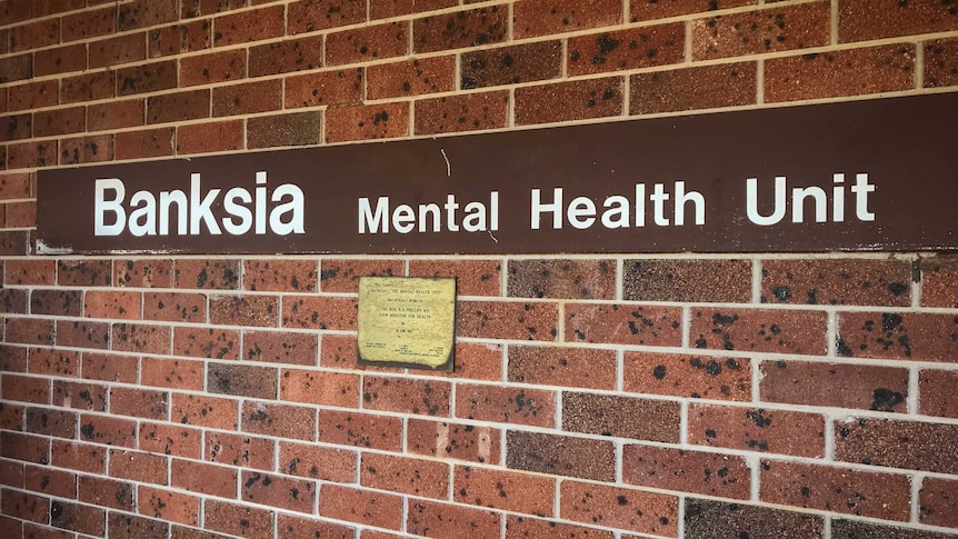 Banksia Mental Health Unit sign on a brick wall