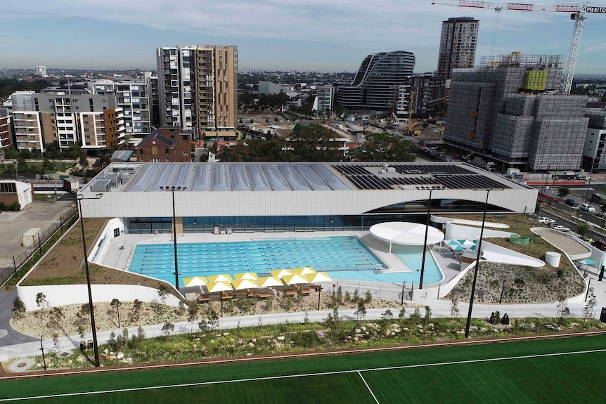 A modern pool with a cityscape behind