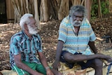 Andrew Galitju Burarrwanga (left) and James Wapiriny Gurruwiwi sitting.