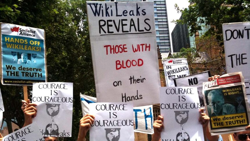 Protesters hold up placards in Sydney's CBC during a rally to support jailed Wikileaks founder Julian Assange. December 10, 2010