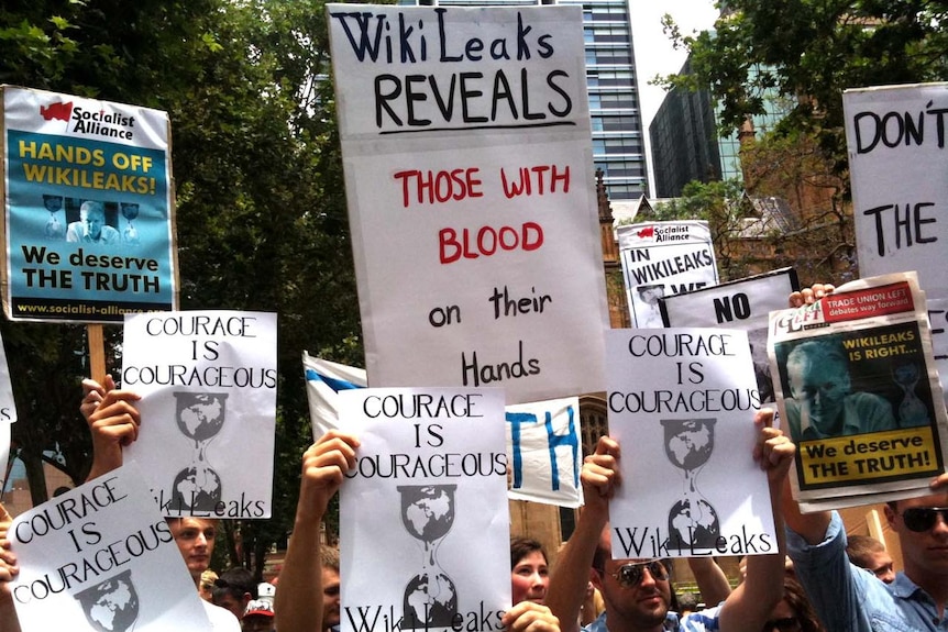 Protesters hold up placards in Sydney's CBC during a rally to support jailed Wikileaks founder Julian Assange. December 10, 2010