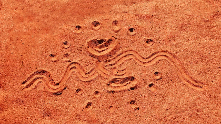 Indigenous drawing in red sand in Central Australia