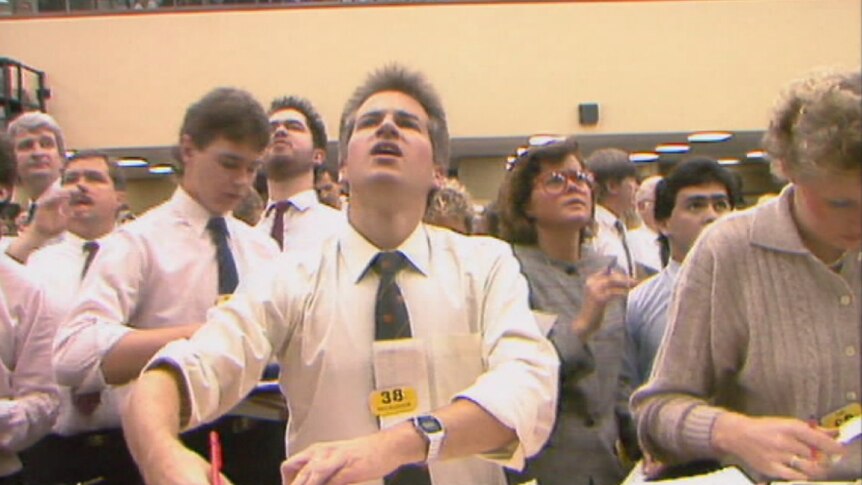 Stockbrokers call out share trades on the market floor during the Black Tuesday crash, October 20, 1987