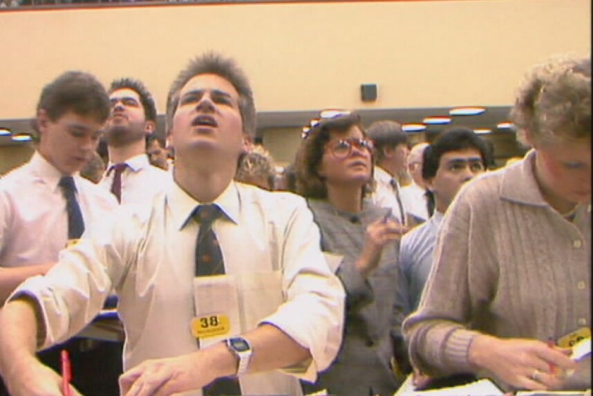 Stockbrokers call out share trades on the market floor during the Black Tuesday crash, October 20, 1987