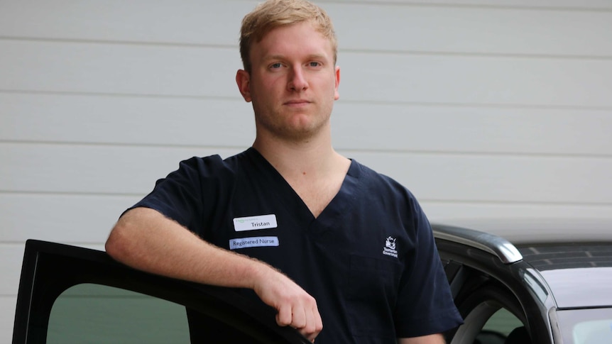 Nurse Tristan Streefland next to his car